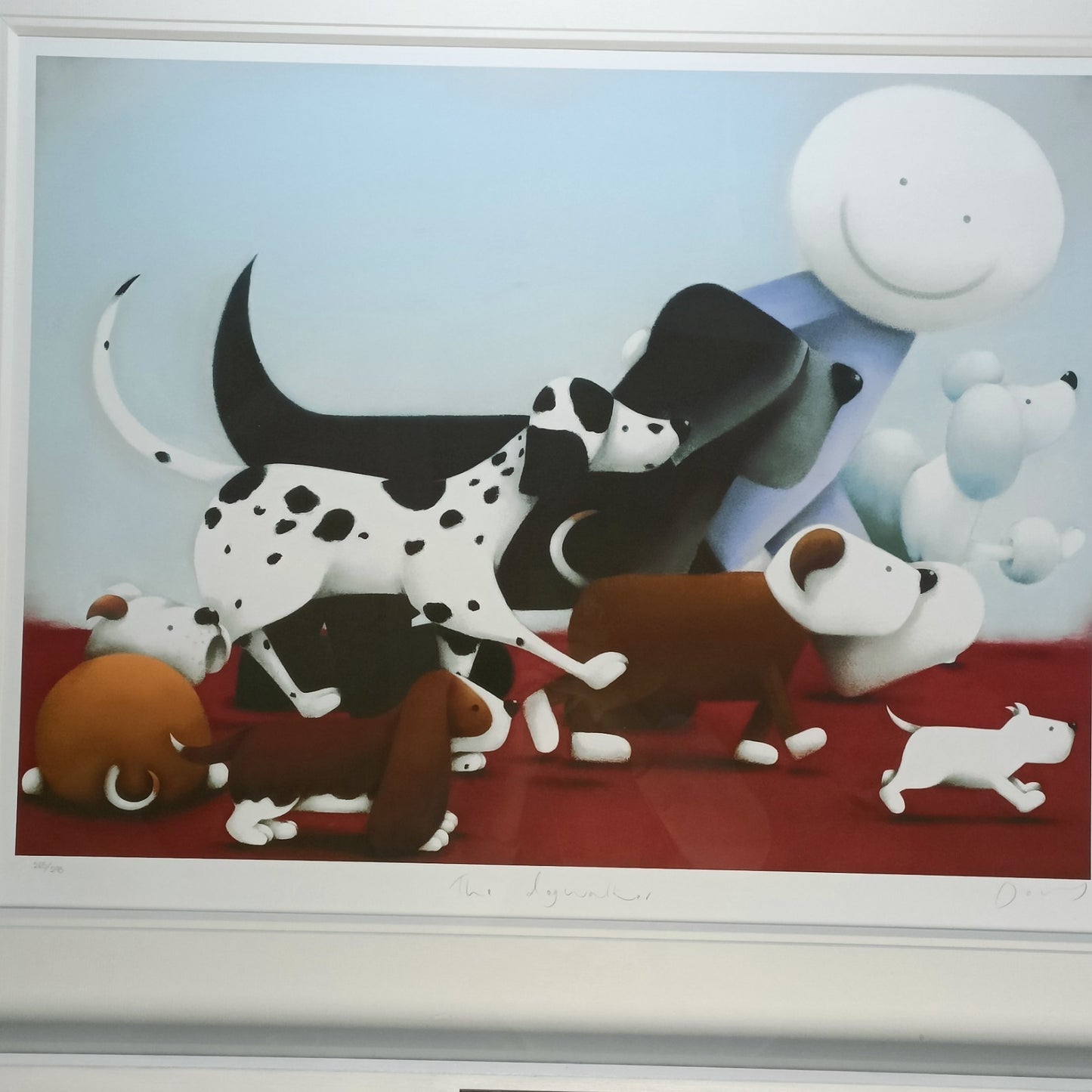 Limited edition framed print "The Dog Walker" by Doug Hyde, numbered 265 of 295, displayed in a decorative frame.