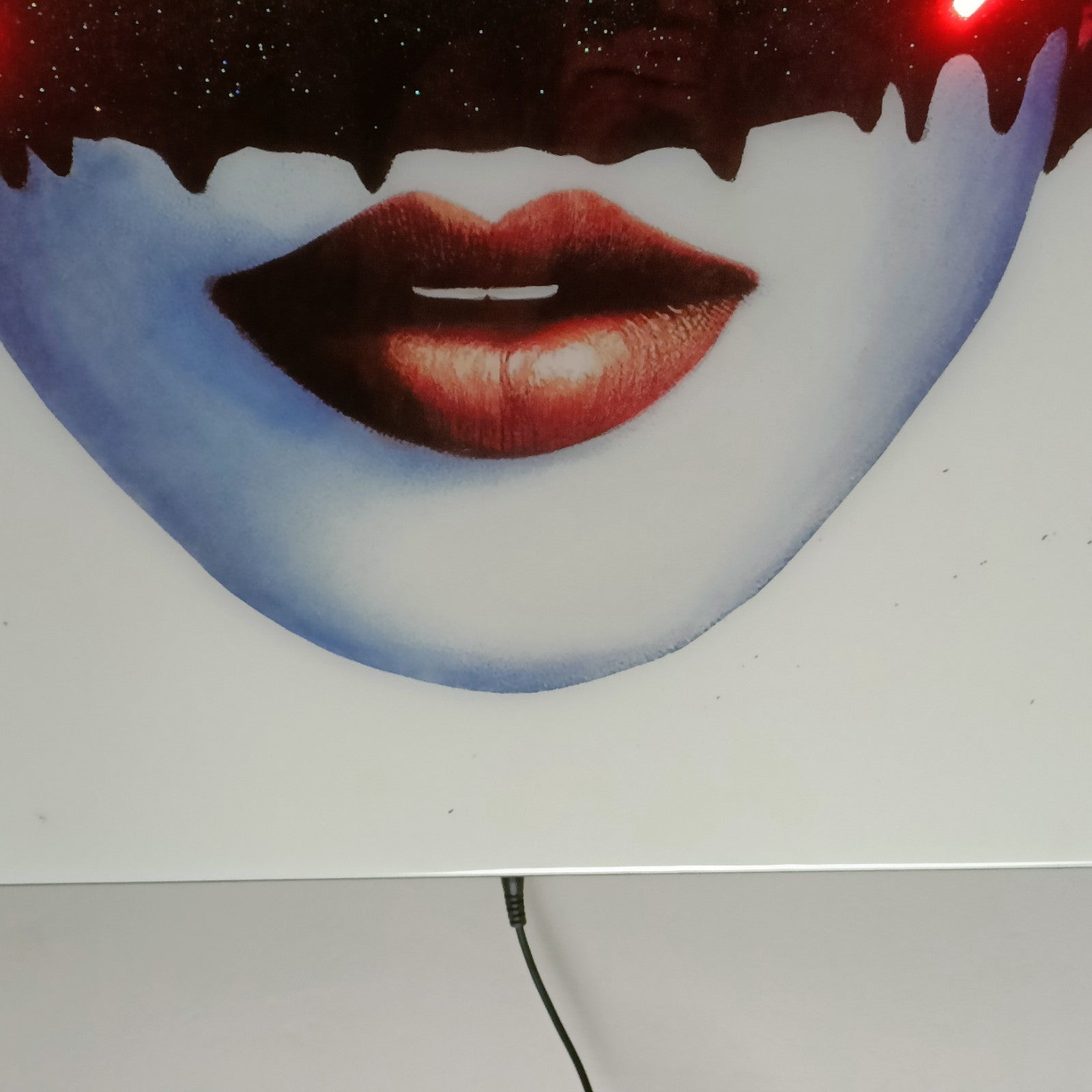 Large LED artwork by MAXIM, titled "Girls Future" in red, featuring bold graphic design, part of Keith A Palmer's Prodigy series.