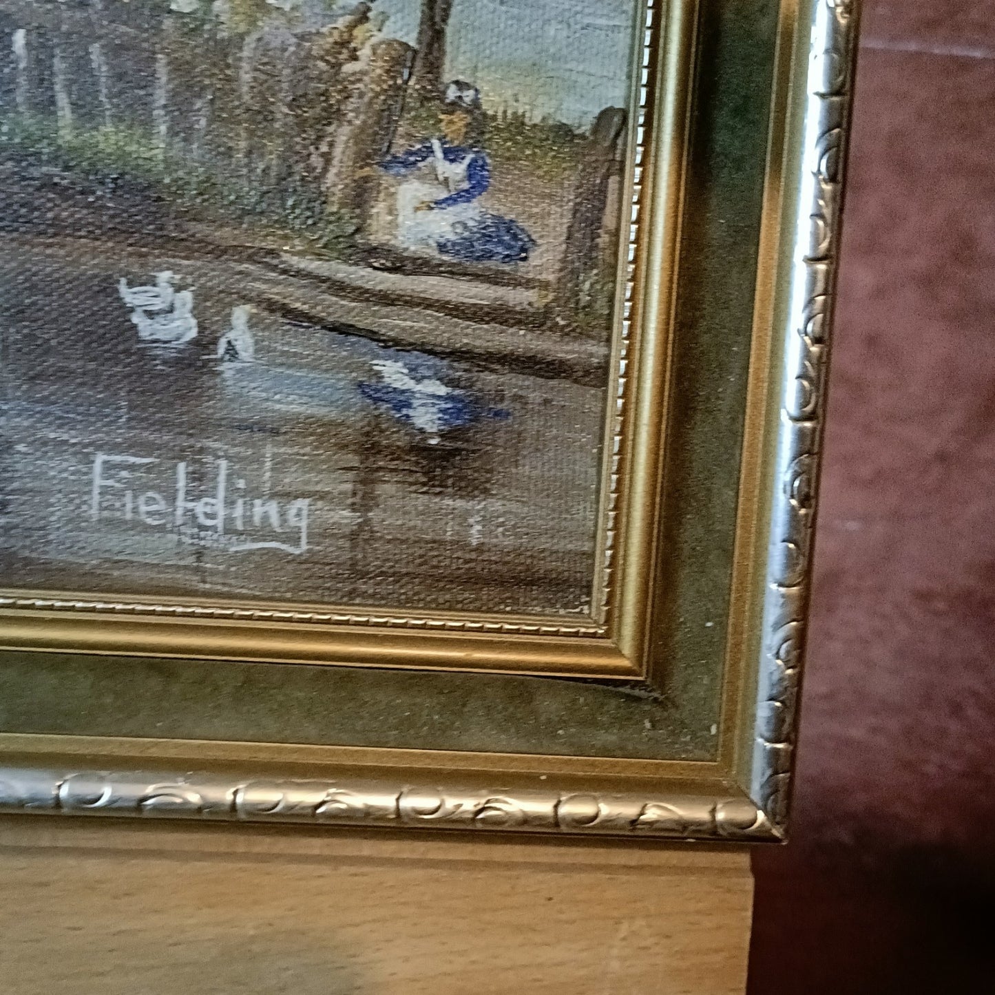 Framed original oil on canvas painting of Thatch Cottage on River Nadder by Curated Treasures in a decorative frame.