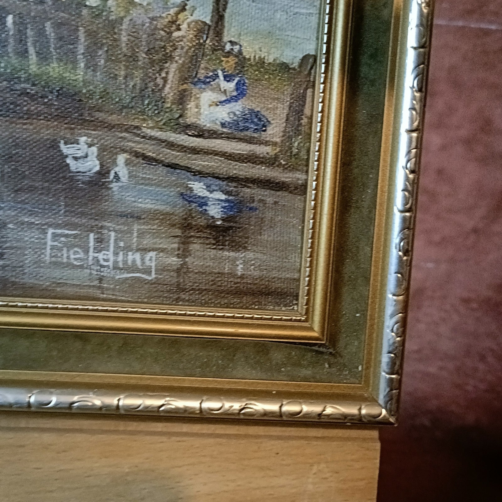 Framed original oil on canvas painting of Thatch Cottage on River Nadder by Curated Treasures in a decorative frame.