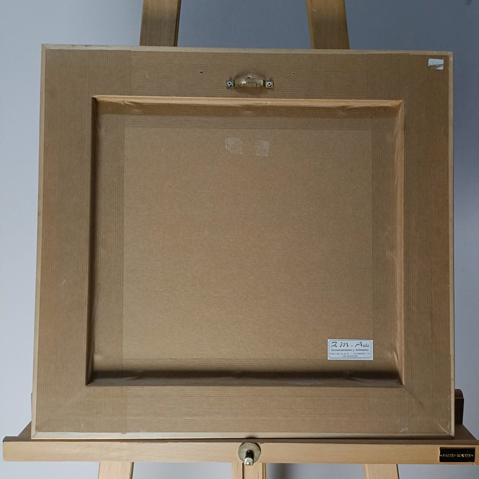 Framed signed oil painting of a seated ballerina titled "Seated Ballerina II" by Marisa Mallol, displayed in a stylish frame.