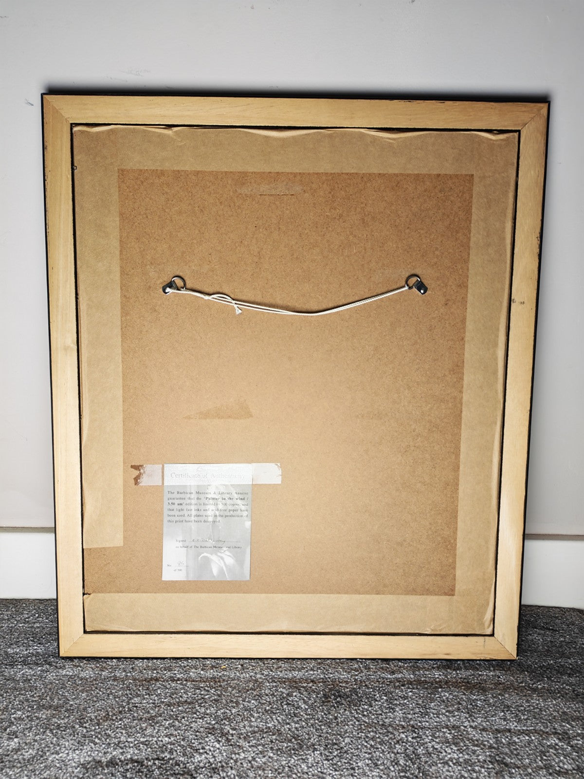 Framed limited edition print of Robert Lenkiewicz's "Painter in the Wind / 3.50am," signed, numbered 85 of 500, displayed with a sleek border.