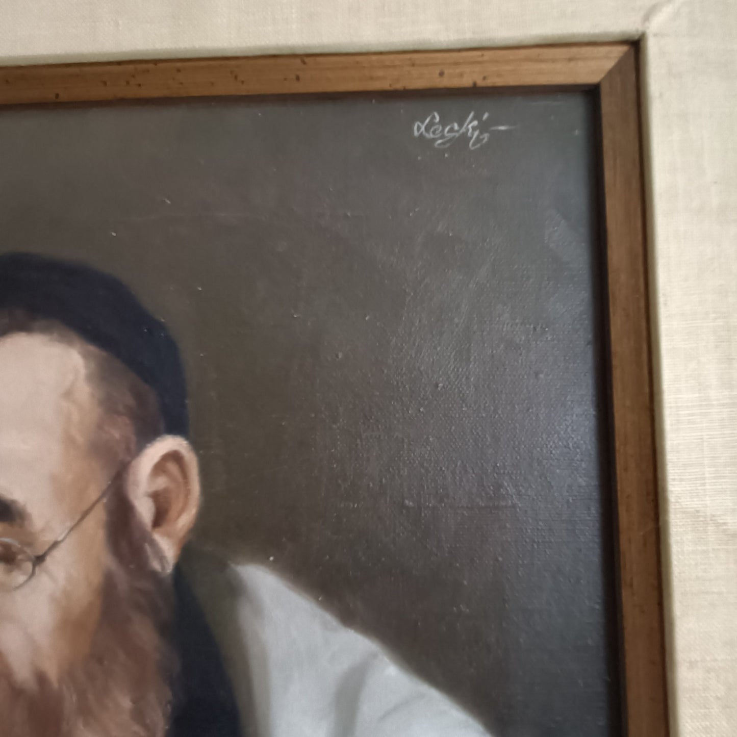 Framed original oil on canvas portrait of a rabbi by SOLOMAN LESKI, showcasing detailed religious attire and expressive features.